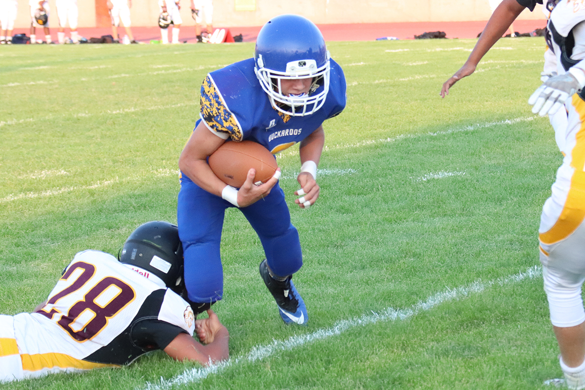 Caden Ricci on a quarterback keeper. /Ron Espinola • The Brand