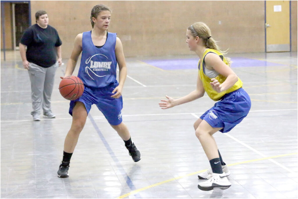 Rachel Garrison tries to maneuver around to the basket ./ Ron Espinola  • The Brand