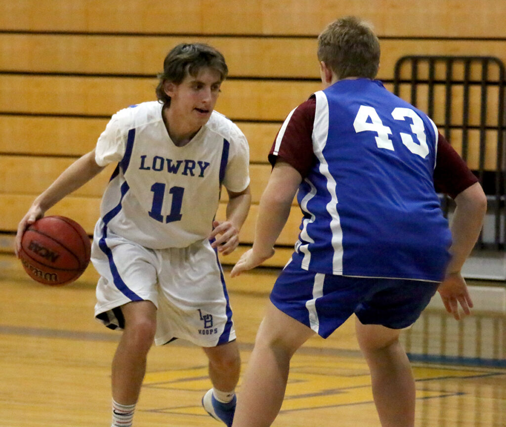 Taz Milton looks for a way by the defender./Peyton Capellen • The Brand