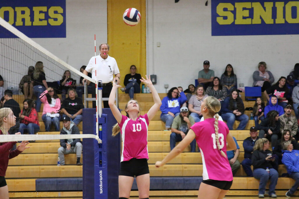 Megan Cook sets the ball up for McKenzie Peterson./Faith Holland • The Brand