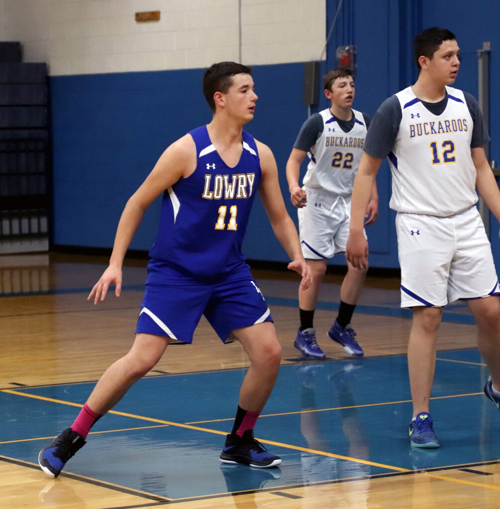 Brennan Coleman,  Dante Cassinelli, and Marcos Rodriguez prepare for a play. /Ron Espinola • The Brand