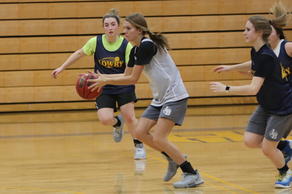 Jovi Kuskie goes to pass the ball./Ron Espinola • The Brand