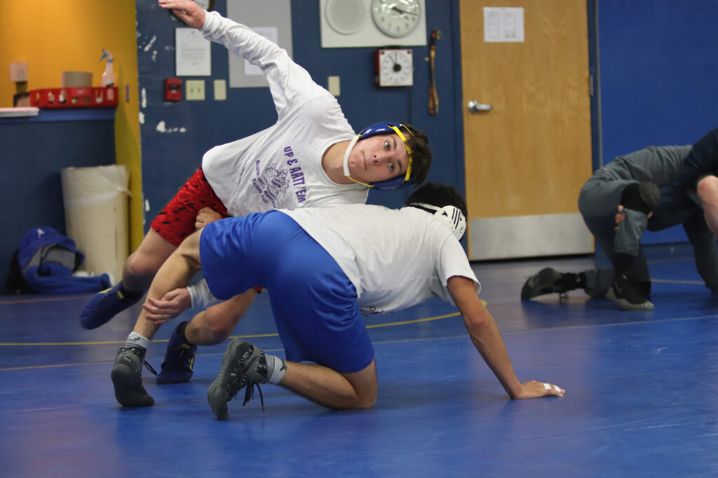  Jesse Hawkins tries to take down opponent during practice. Ron Espinola • The Brand