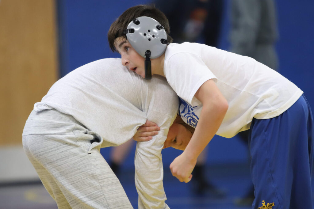 Coda Nichols practices against teammate Rodger Facey./Ron Espinola • The Brand