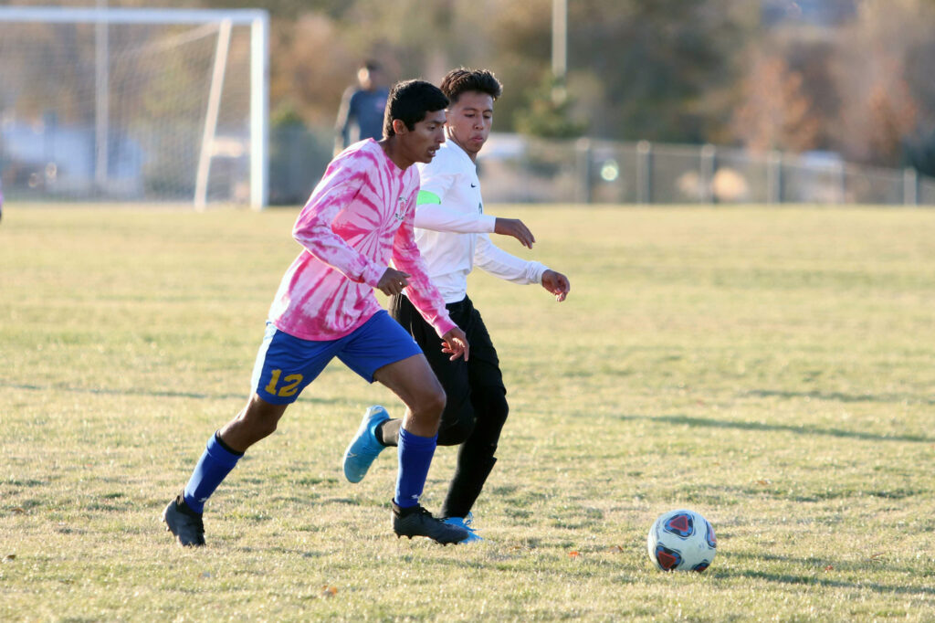 Celso Ruiz challenges for possession./Ron Espinola • The Brand