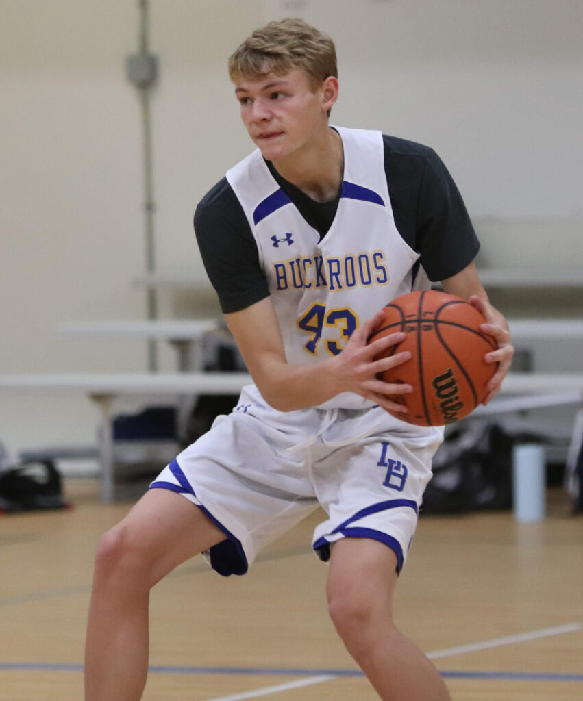 Cal Peters looks for an open teammate./Ron Espinola • The Brand