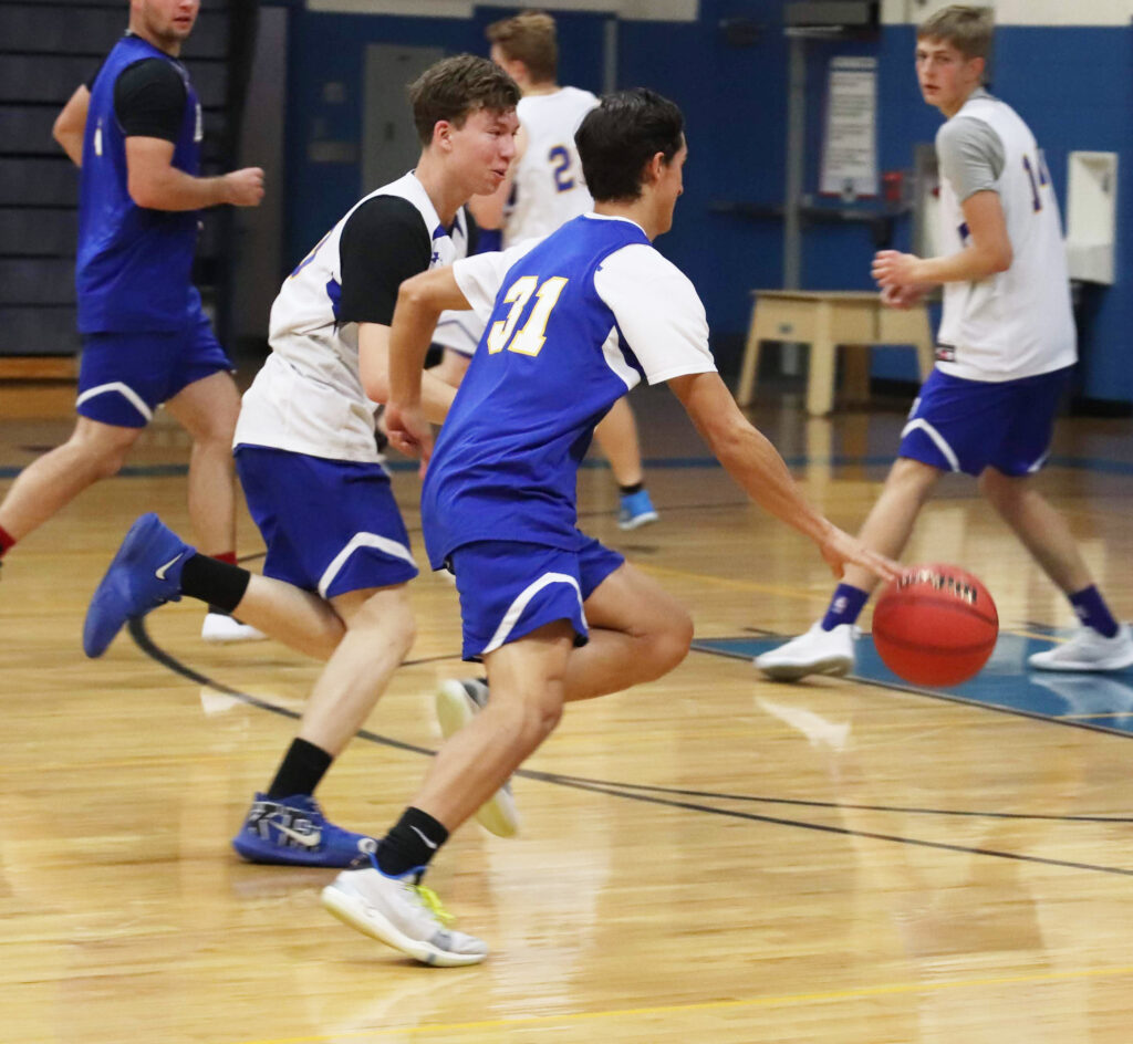 Chance Huitt (31) dribbles by Michael Casalez /Ron Espinola • The Brand