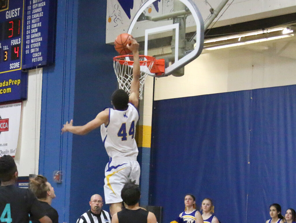 Kevin Guzman comes close on the dunk./Clarissa Olson • The Brand