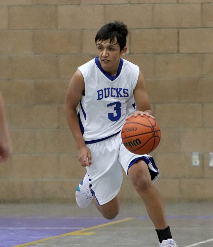 Iysis Arriola dribbles up court. /Ron Espinola • The Brand