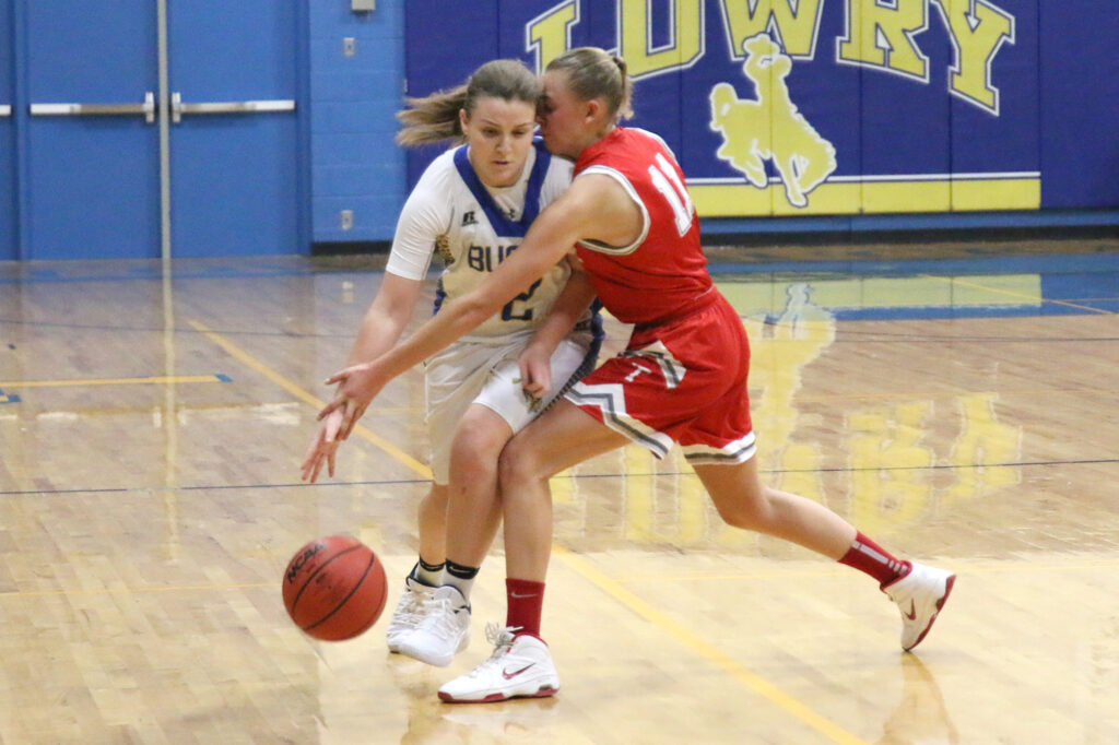 Sydney Connors tries to dribble by a defender./Ron Espinola • The Brand