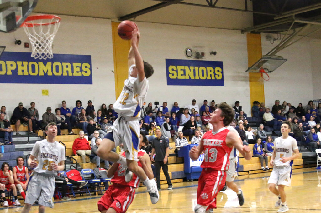 Brendan Domire goes up for a dunk./Ron Espinola • The Brand
