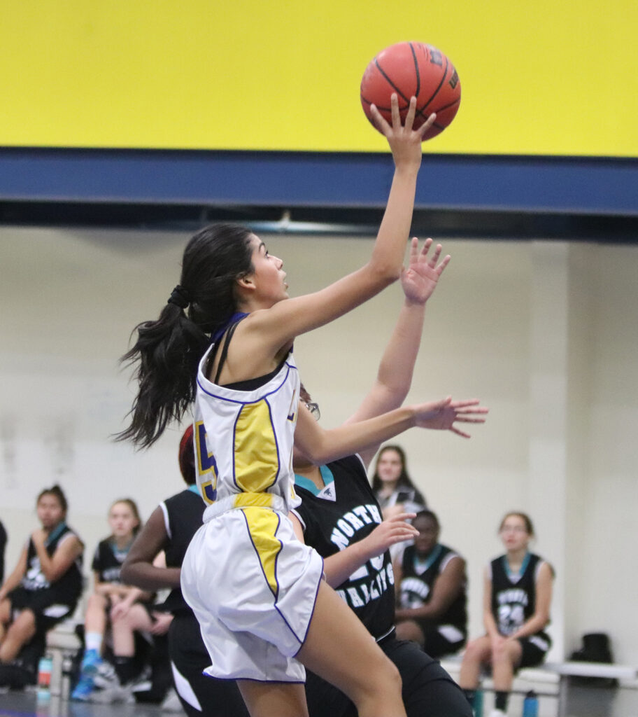 Alyssa Perez goes in for a lay-up./Ron Espinola • The Brand