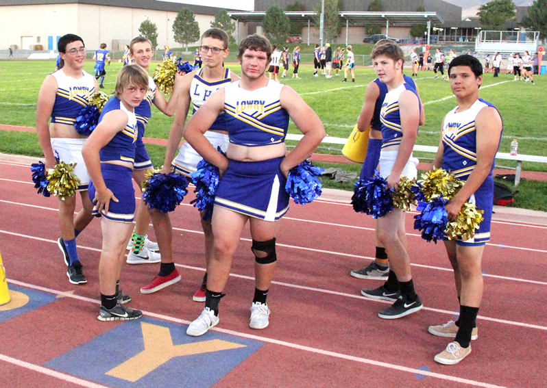 Powderpuff cheerleaders pose as they cheer on the losing team./Brody Goucher • The Brand