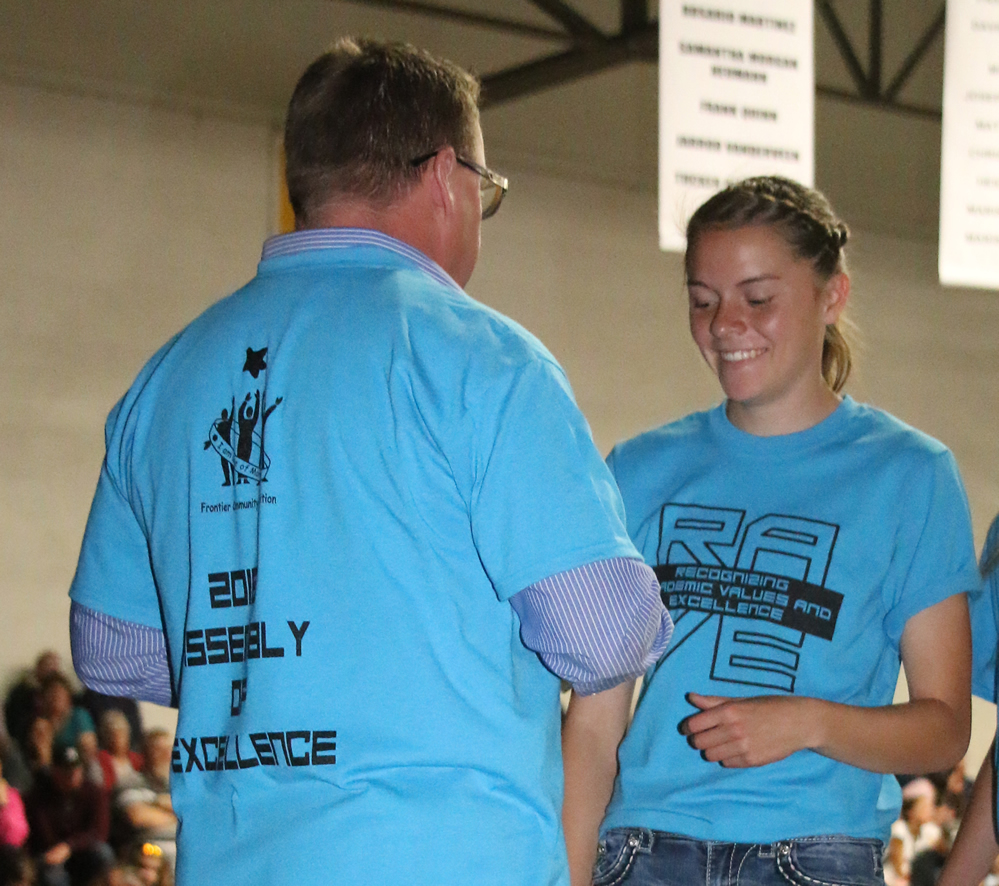 Shelby Garrison receives an award from Mr. Connors./Ron Espinola • The Brand