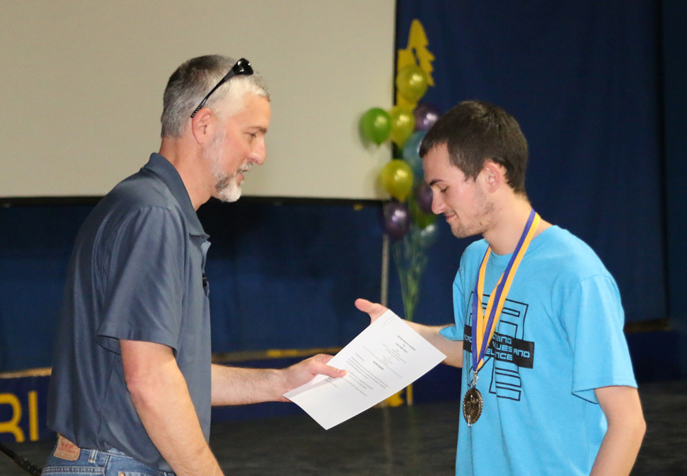 Mr. Eastman from the mining foundation recognizes Jacob Palmer./Ron Espinola • The Brand